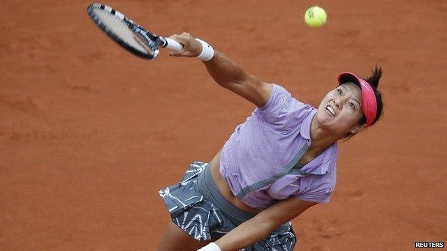 Li Na serving during the French Open championship