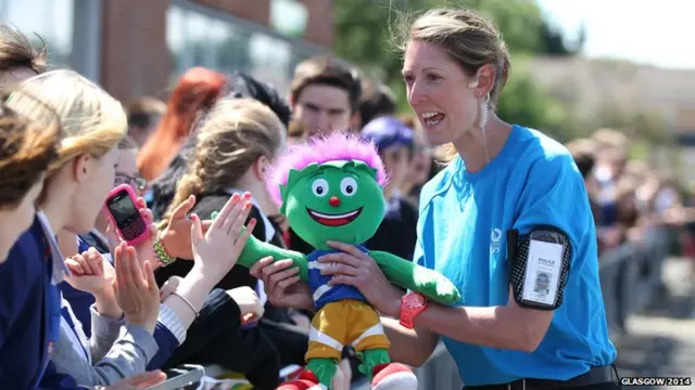 The security team show off the Commonwealth Games mascot, Clyde, to the crowds during the relay in South Ayrshire earlier this morning.