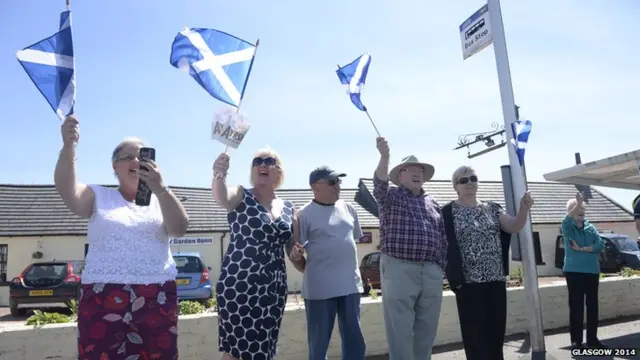 Members of the public welcome the Glasgow 2014 Queen's Baton through South Ayrshire.