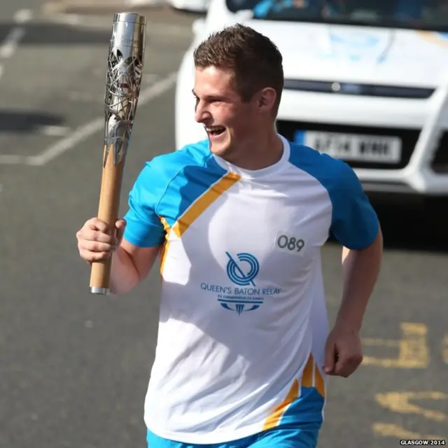 Robert Ferguson enjoys his moment running with the baton