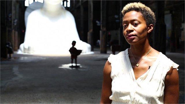 Kara Walker in front of her sugar sculpture