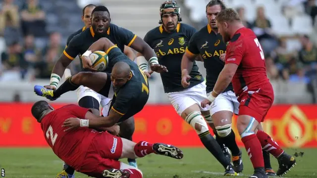 South Africa full-back Cornal Hendricks is brought to ground.