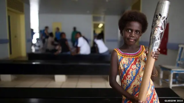 A girl holds the baton in Solomon Islands