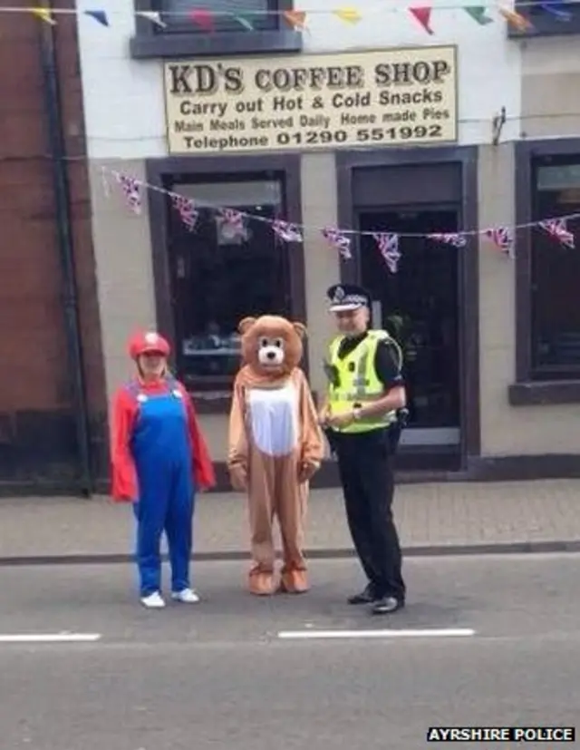 People dress in costume during baton relay