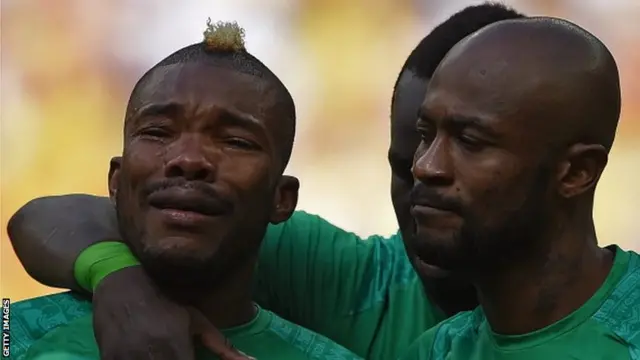 Ivory Coast midfielder Serey Die cries during the national anthem