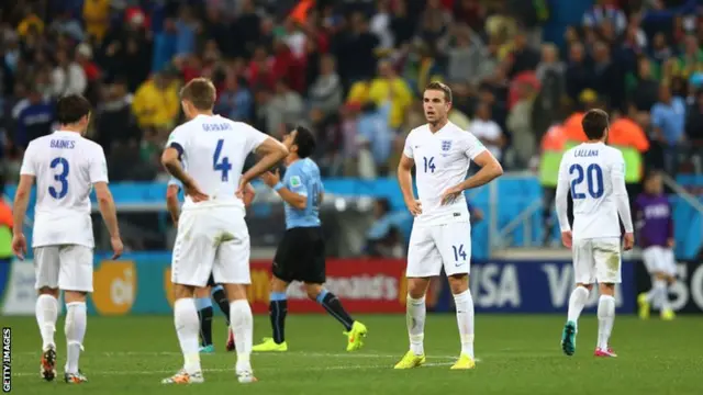 England players react with disappointment after losing to Uruguay