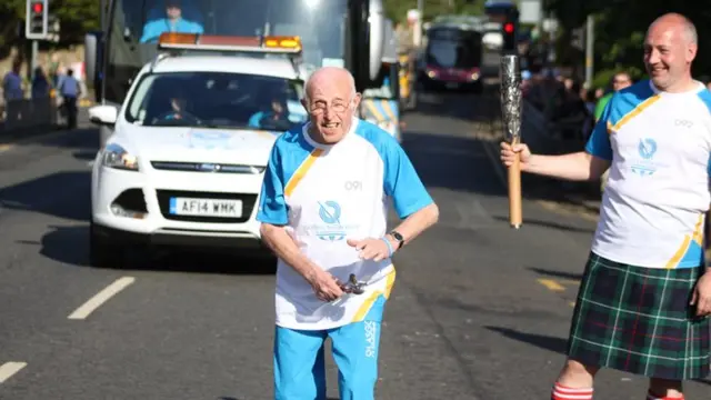 Peter Lee with his spoons at the Queen's Baton Relay