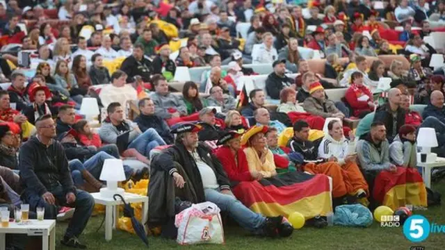 Germany fans watch football on sofa