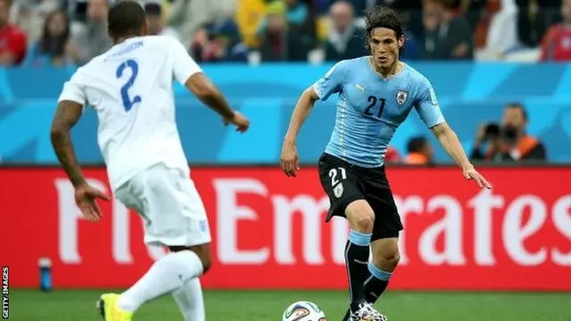 England's Glen Johnson (left) faces up to Uruguay's Edinson Cavani