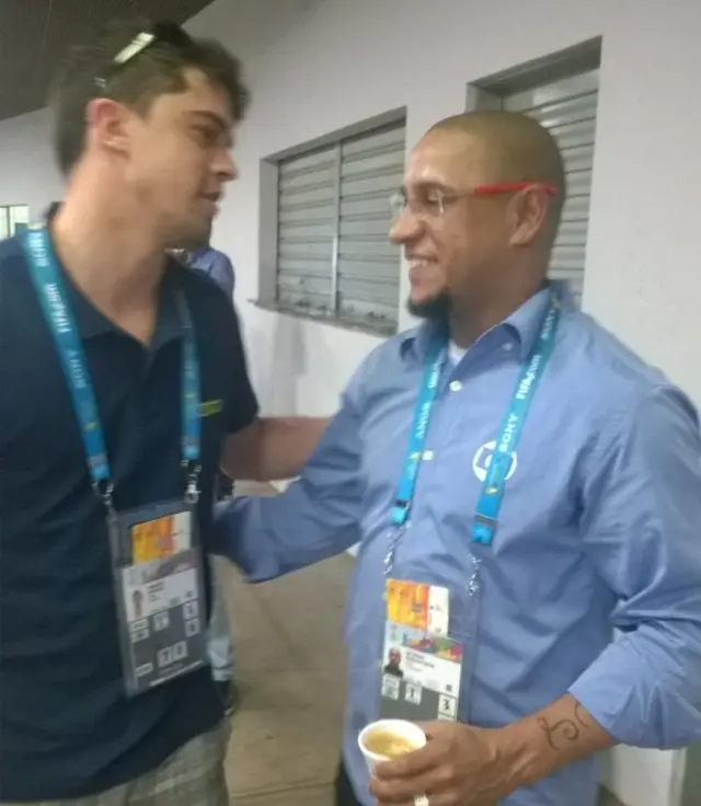 Brazilian translator Mateus Donato (left) with former Brazil full-back Roberto Carlos