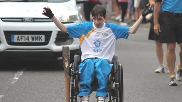 Scott Laidlaw with the Queen's Baton