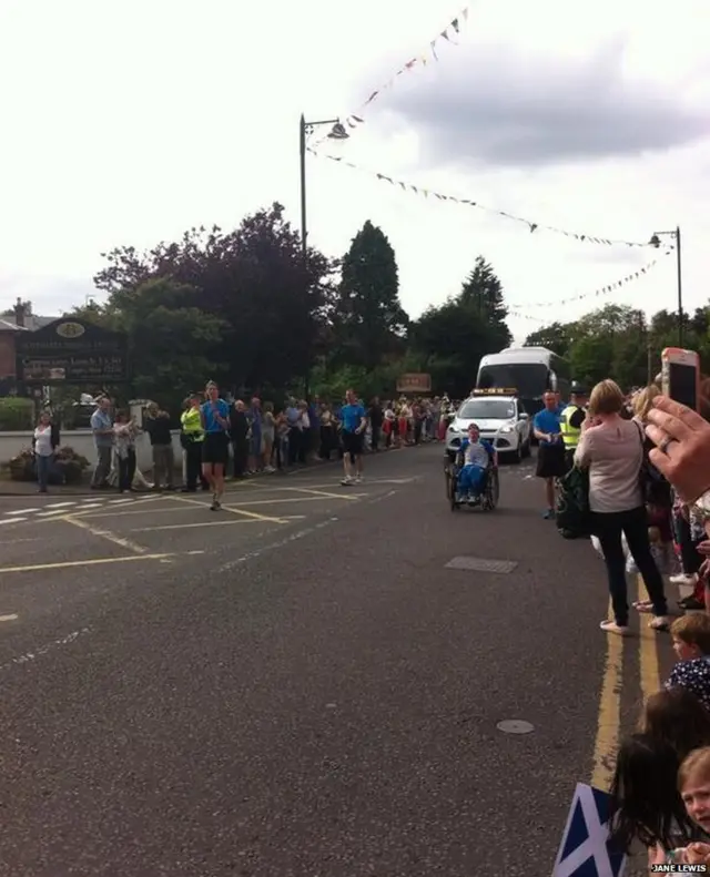 Crowd watch baton relay