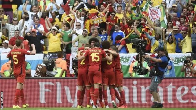 Belgium footballers celebrate a goal against Russia