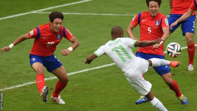 South Korea's defender Hong Jeong-Ho and South Korea's defender Kim Young-Gwon fight for the ball