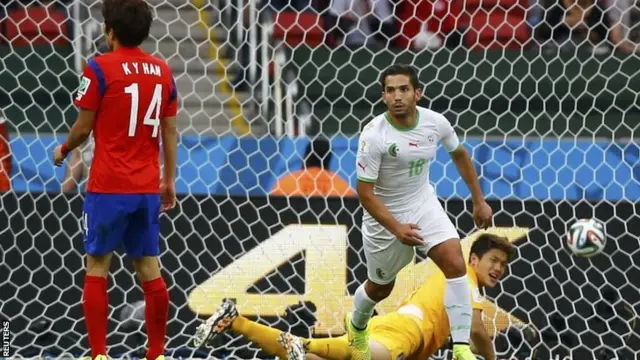 Algeria's Abdelmoumene Djabou celebrates after scoring Algeria's third goal