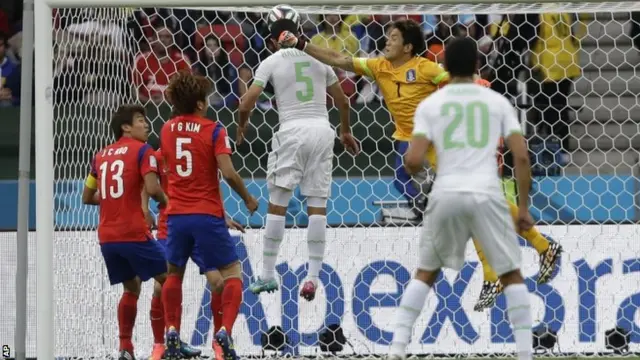 Algeria's Rafik Halliche, centre, scores his side's second goal