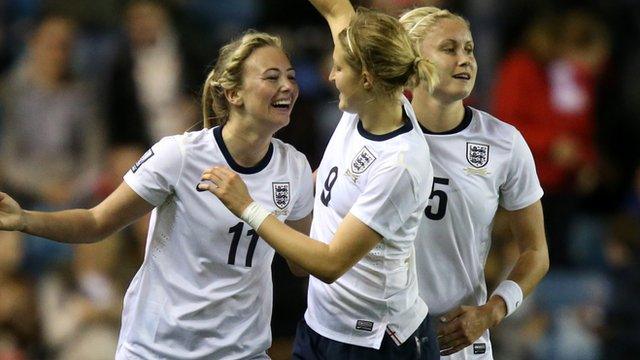 England's Toni Duggan, left celebrates with teammate Ellen White after scoring against Wales in the World Cup qualifier in October