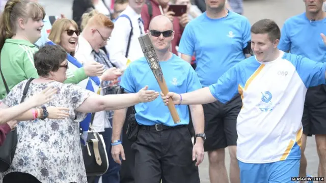 Ryan Boyd lets woman in crowd touch Queen's Baton