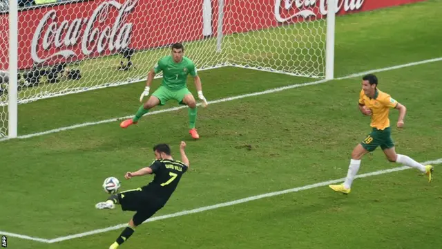 David Villa of Spain shoots over in the ame between Spain and Australia