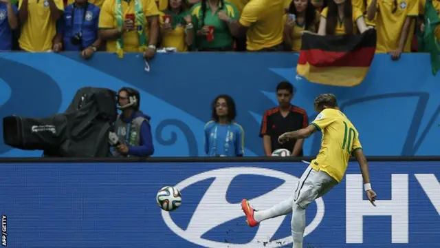 Brazil's Neymar takes a free-kick against Cameroon