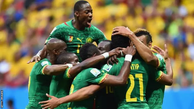 Cameroon celebrate scoring after drawing level with Brazil