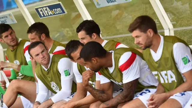 Wayne Rooney and Steven Gerrard take their seats among England's substitues ahead of the game with Costa Rica