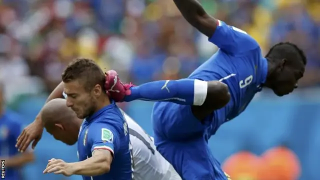 Mario Balotelli jumps for the ball