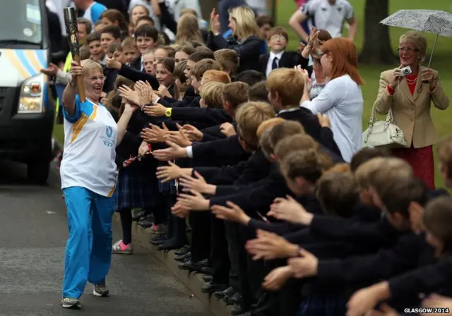 Julia Adamson high-fiving students