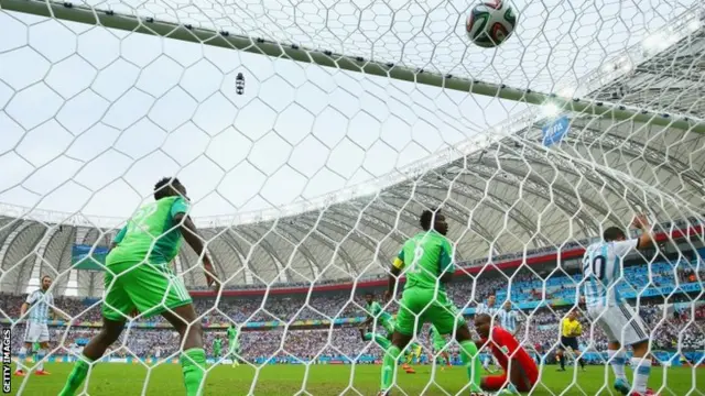 Lionel Messi of Argentina scores his team's first goal