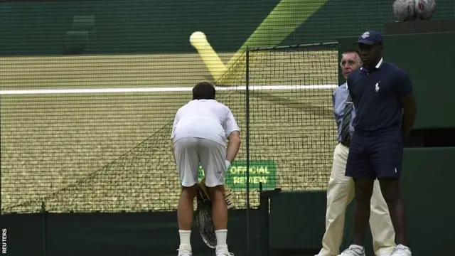 Radek Stepanek checks a replay