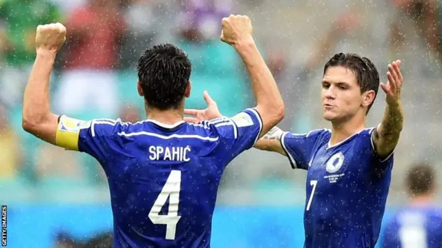 Bosnia-Herzegovina"s defender Emir Spahic and Bosnia-Herzegovina"s midfielder Muhamed Besic celebrate