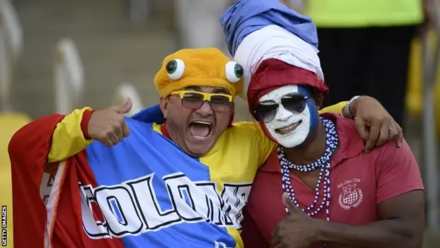 A France fan and an Ecuador fan