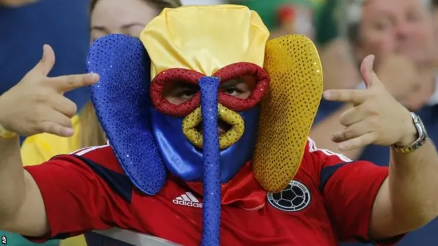 An Ecuador fan gestures at halftime