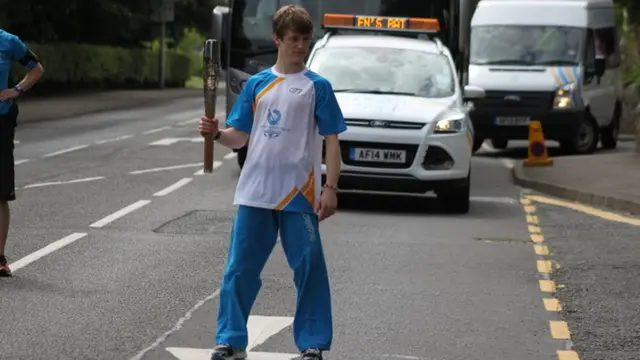 Oliver Carter holds the baton