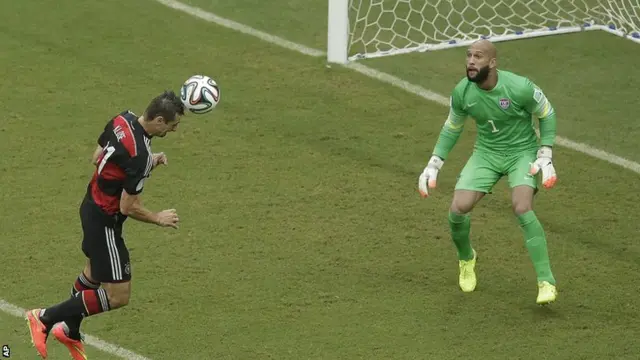 Miroslav Klose heads towards goal for Germany against the USA