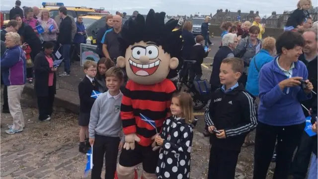 Dennis the Menace poses with some children in Broughty Ferry