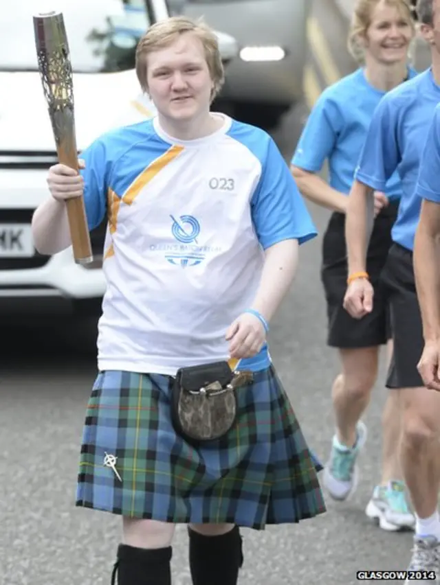 Oliver Smith with Queen's Baton