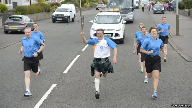 Michael Cordiner with the Queen's Baton