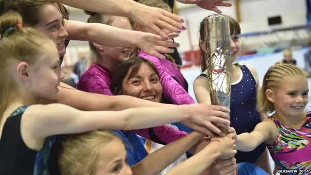 Baton bearer Mhairi Carroll poses for pictures with Dundee's up-and-coming gymnastics hopefuls.