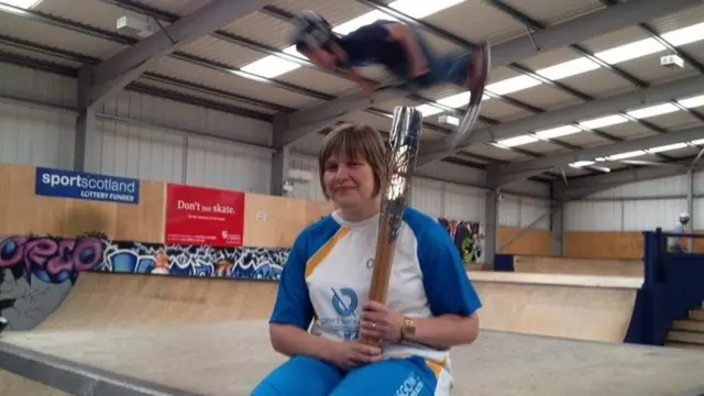 Skate boarding break for the baton