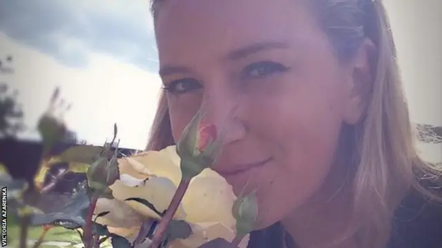 Victoria Azarenka smelling flowers at Wimbledon