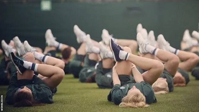 Wimbledon ball boys and girls warm up