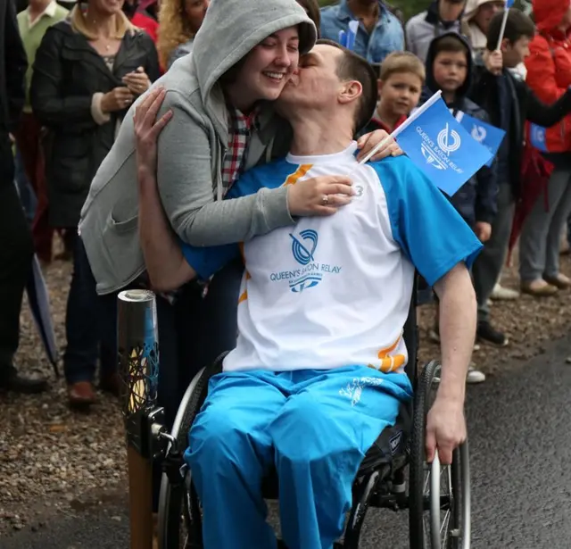 Trevor Eakin gets a kiss and cuddle before her prepares to take baton towards Glamis Castle.