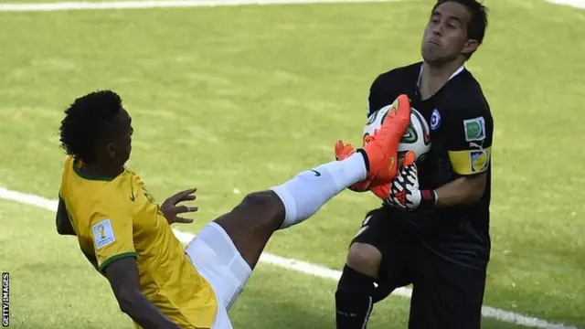 Jo collides with the Chile keeper