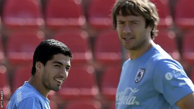 Luis Suarez and Diego Lugano