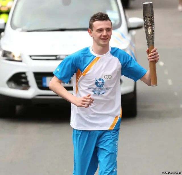 Jordan Chapman carries the Glasgow 2014 Queen's Baton through Turriff in Aberdeenshire.