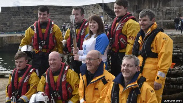 former Commonwealth gold medallist Kay Copland with the RNLI lifeboat crew at Banff Harbour