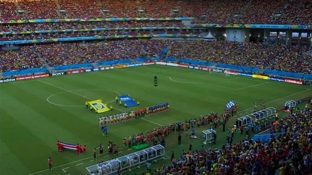 Players stand for anthems