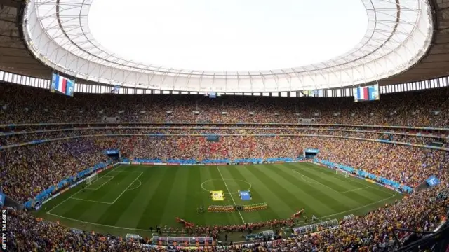 Players stand for anthems