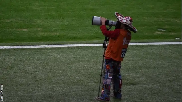 Cameraman wears Mexican hat
